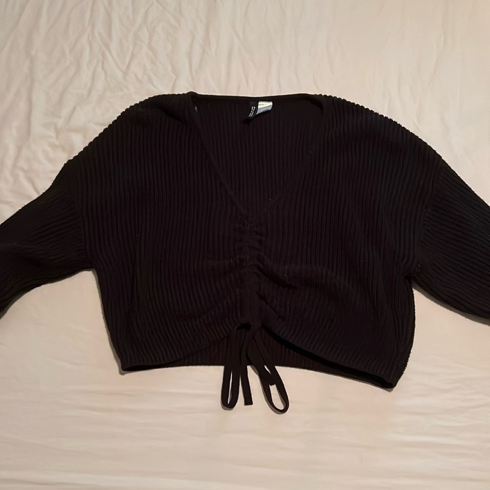 Ribbed sweater crop top. Adjustable front.